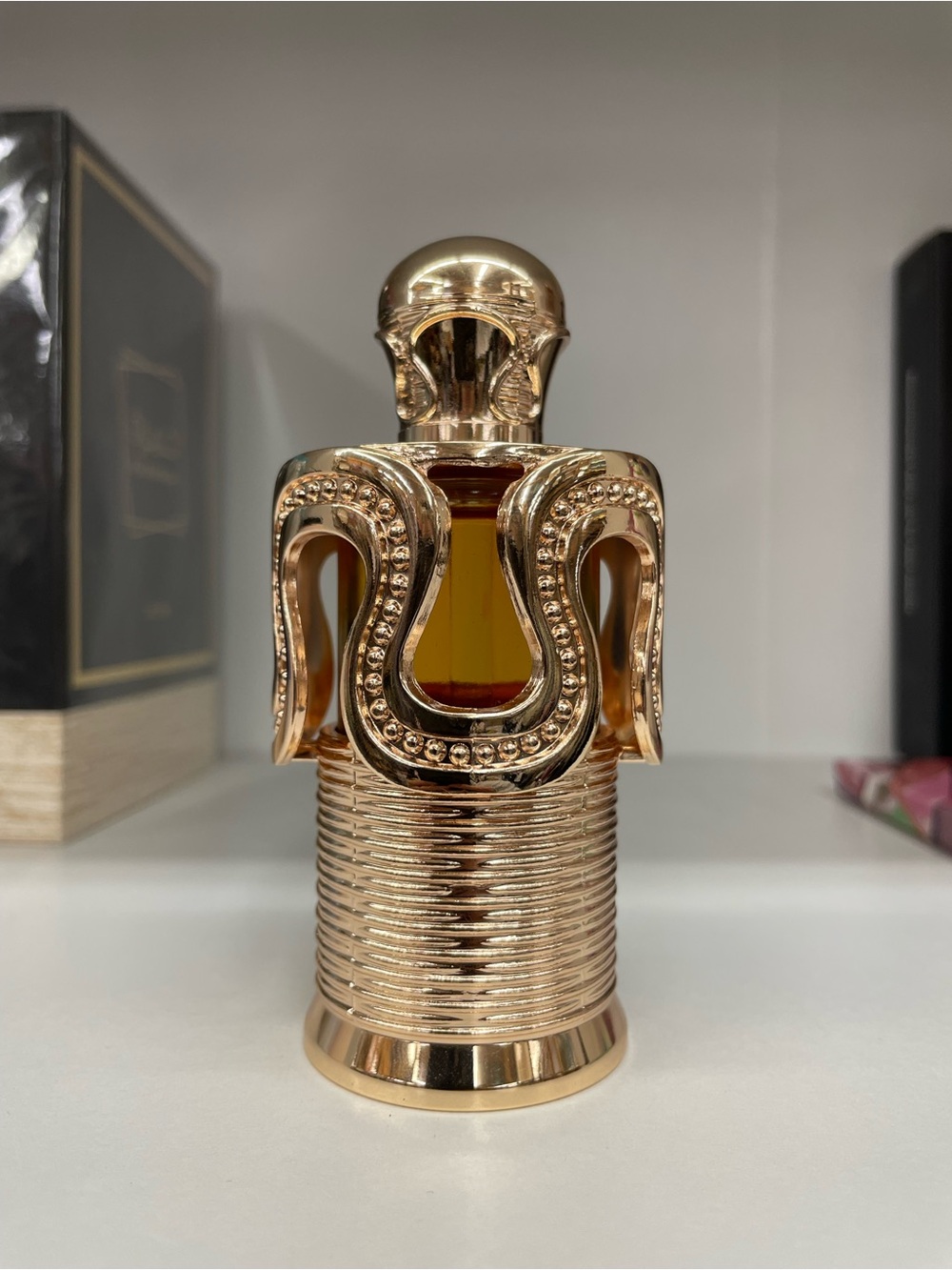 Gold Decorative Bottle with Amber Liquid